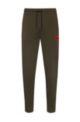 Cotton tracksuit bottoms with red logo patch, Dark Green