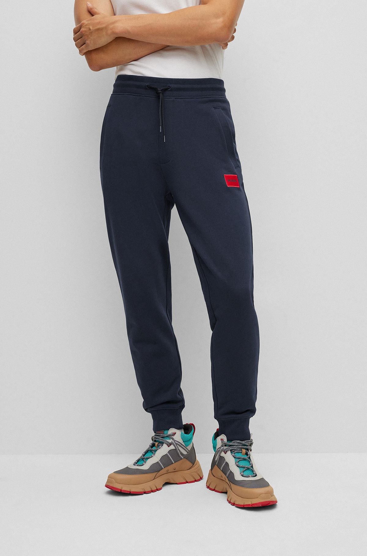 Cotton-terry tracksuit bottoms with red logo label, Dark Blue
