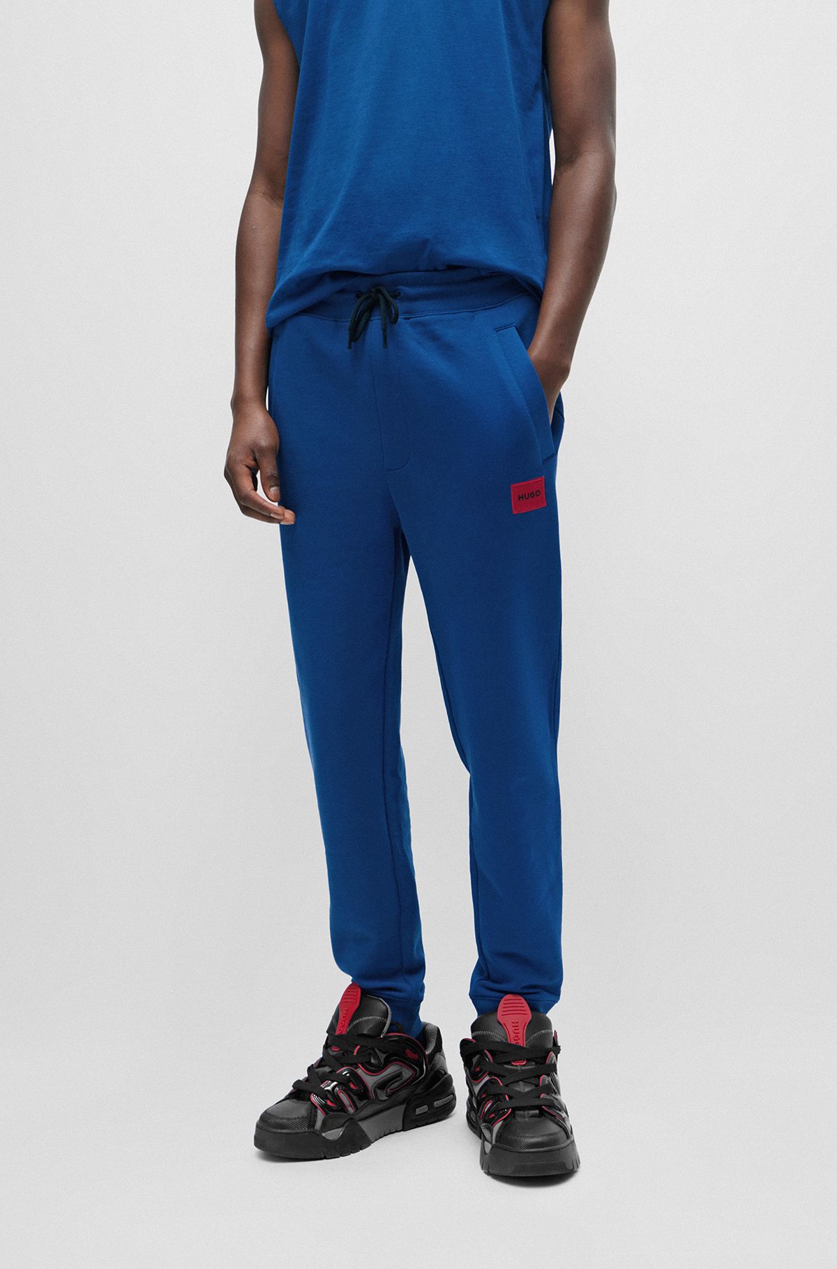 Tracksuit-bukser i bomuldsfrotté med rødt logomærkat, Blå