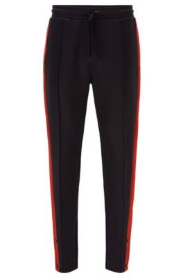 Pantalon Regular Fit en jersey à rayures contrastantes
