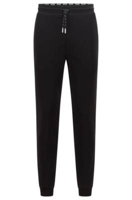Pantalon de survêtement resserré au bas des jambes avec cordon de serrage à rayures