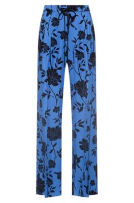 Pantalon large Relaxed Fit à imprimé emblématique de la collection