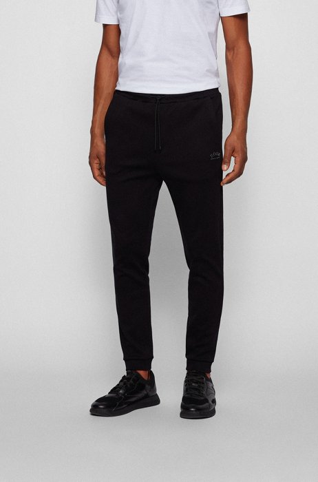 Pantalones de chándal con puños en algodón con estructura de piqué tonal, Negro