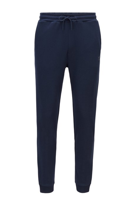 Cuffed tracksuit bottoms in cotton with tonal piqué structure, Dark Blue