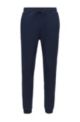 Cuffed tracksuit bottoms in cotton with tonal piqué structure, Dark Blue