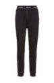 Tapered-fit tracksuit bottoms with logo waistband, Black