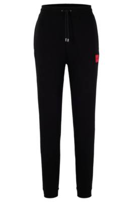 HUGO - Cotton-terry tracksuit bottoms with logo label