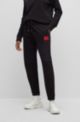 Cotton-terry tracksuit bottoms with logo label, Black