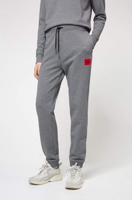 Cotton-terry tracksuit bottoms with logo label, Grey