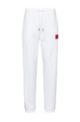 Cotton-terry tracksuit bottoms with logo label, White