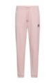 Cotton-terry tracksuit bottoms with logo label, light pink