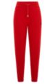 Pantaloni della tuta in terry di cotone con etichetta con logo, Rosso