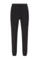 Logo tracksuit bottoms with pixel print and hemmed cuffs, Black