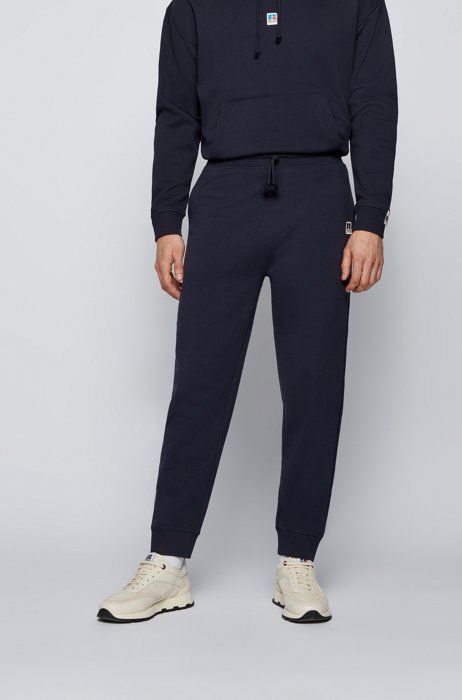 Cuffed tracksuit bottoms in organic cotton with exclusive logo, Dark Blue