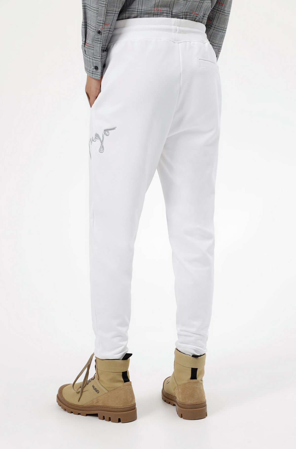 Cuffed tracksuit bottoms in organic cotton with handwritten logo, White