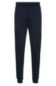 Cuffed tracksuit bottoms in organic cotton with handwritten logo, Dark Blue