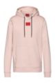 Hooded sweatshirt in terry cotton with red logo label, light pink