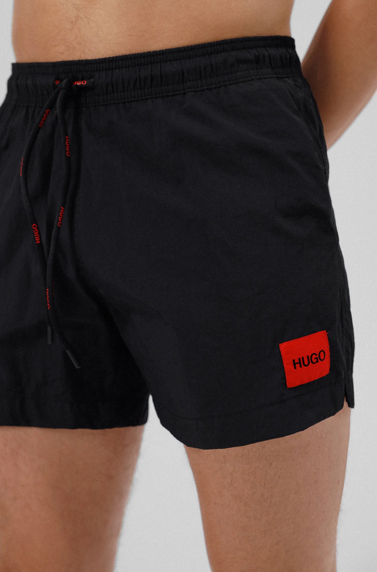 Quick-drying swim shorts in recycled fabric with logo label, Black