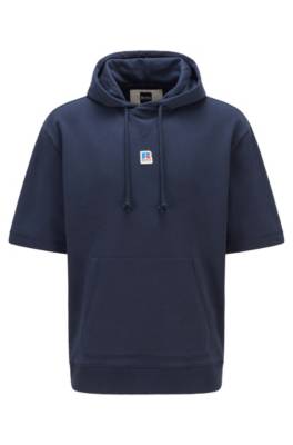 Sweat à capuche à manches courtes en coton biologique avec logo exclusif
