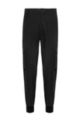 Cuffed slim-fit cargo pants in performance fabric, Black