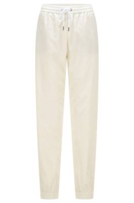 Pantalon Relaxed Fit avec bas des jambes zippés et resserrés