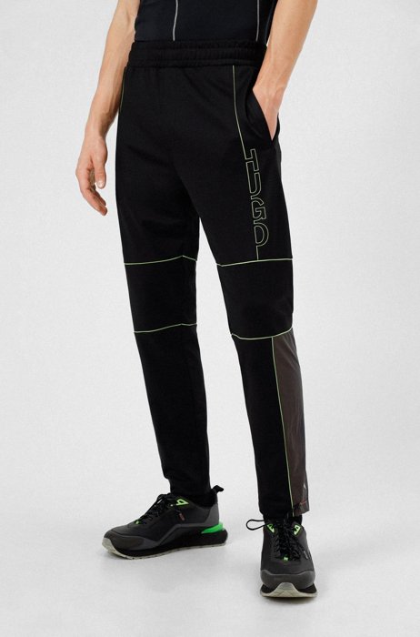 Regular-fit tracksuit bottoms in performance-stretch twill, Black