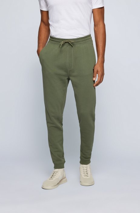 Cotton-terry tracksuit bottoms with logo patch, Green