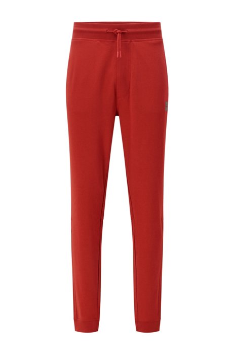 Cotton-terry tracksuit bottoms with logo patch, Red