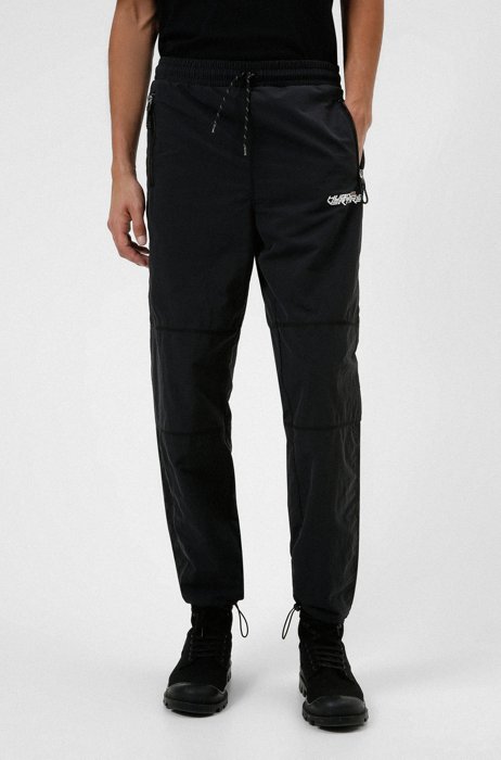 Relaxed-fit tracksuit bottoms with exclusive branding, Black