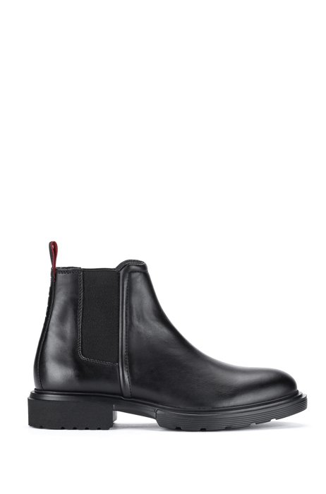 Chelsea boots in leather with raised logo, Black