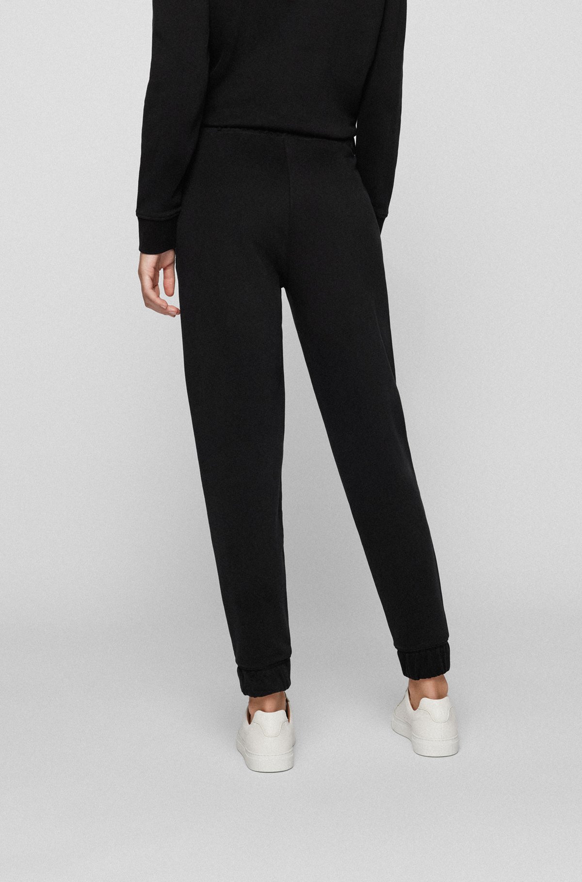 Cuffed tracksuit bottoms in cotton with sequinned seams, Black