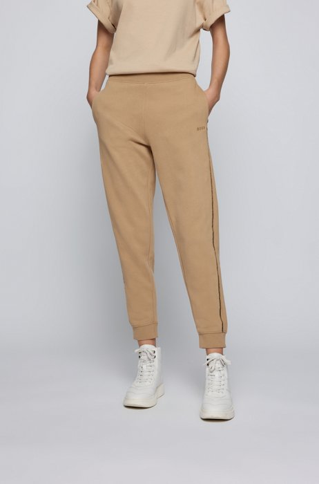 Cuffed tracksuit bottoms in cotton with sequinned seams, Light Beige