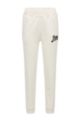 Organic-cotton-blend tracksuit bottoms with logo patch, White