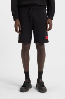 Cotton-terry shorts with red logo label, Black