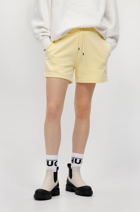 Cotton-terry relaxed-fit shorts with handwritten logo, Light Yellow