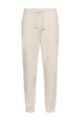 Relaxed-fit tracksuit bottoms in organic French terry cotton, Light Beige