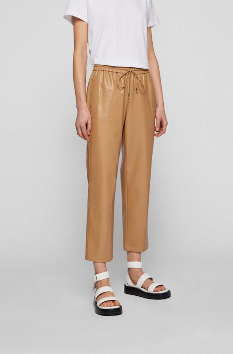 Relaxed-fit tracksuit bottoms in faux leather, Beige