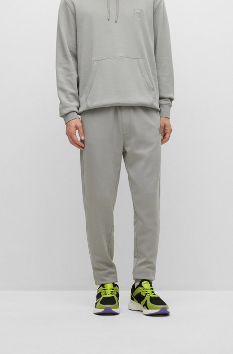 Cotton-terry tracksuit bottoms with logo patch, Grey