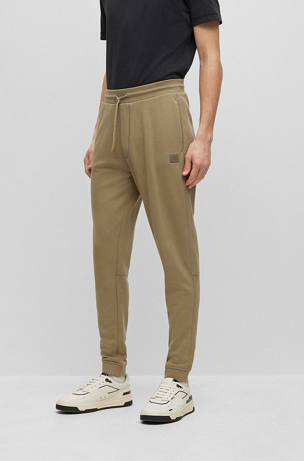 Cotton-terry tracksuit bottoms with logo patch, Khaki