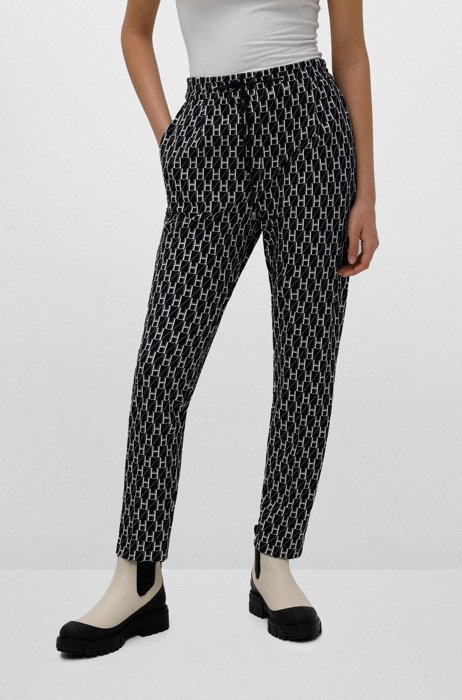 Regular-fit trousers with all-over monogram print , Blue Patterned