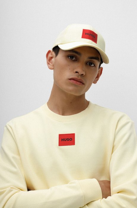 Cotton-twill cap with red logo label, Light Yellow