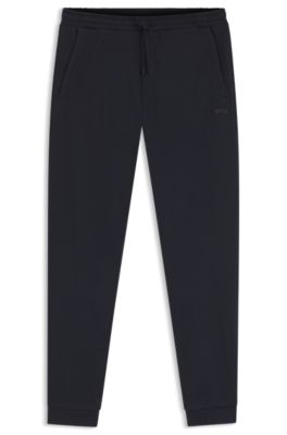 Cotton tracksuit bottoms with curved logo, Dark Blue