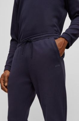Cotton tracksuit bottoms with curved logo, Dark Blue