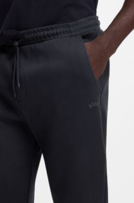 Cotton tracksuit bottoms with curved logo, Dark Blue