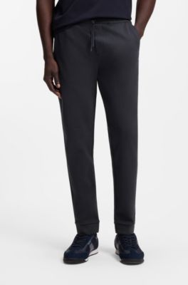 Cotton tracksuit bottoms with curved logo, Dark Blue