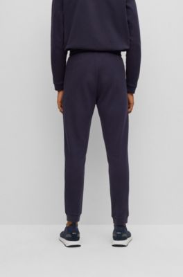Cotton tracksuit bottoms with curved logo, Dark Blue