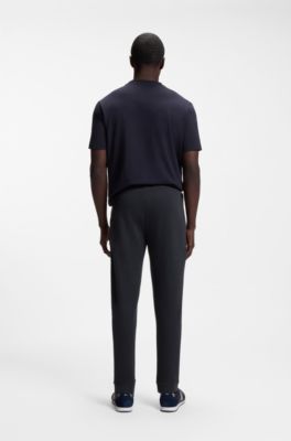 Cotton tracksuit bottoms with curved logo, Dark Blue