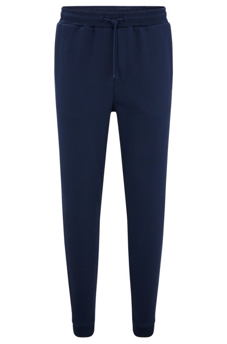 Cotton tracksuit bottoms with curved logo, Dark Blue