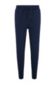 Organic-cotton tracksuit bottoms with curved logo, Dark Blue
