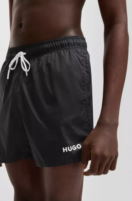 Fully lined swim shorts with contrast logo